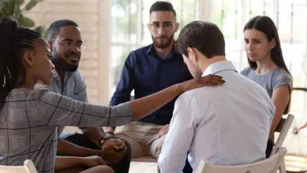 People receive counseling during a group therapy session