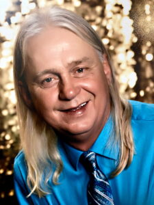 A middle-aged person at an Alabama funeral home offers cremation and burial services.