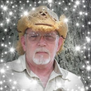 An elderly man in glasses and straw hat beneath a tree, symbolizing funeral and cremation services in Alabama.